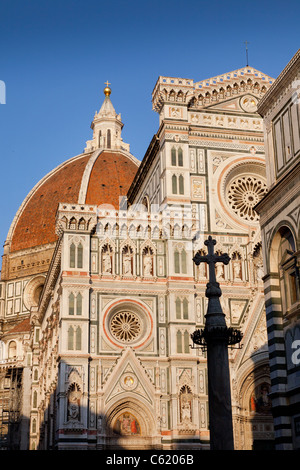 The Basilica di Santa Maria del Fiore, Duomo, Florence, evening sunlight illuminates the facade. Stock Photo