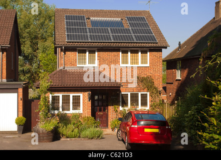 Solar panels on house roof with regenerative energy system Stock Photo