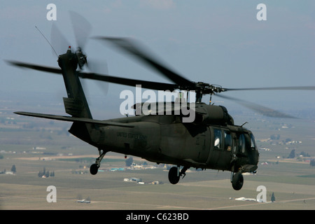 UH-60 Blackhawk Helicopter flys over California war US Army Air Force arsenal Stock Photo