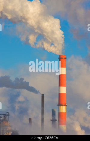 Smoke stack at Oil refinery Stock Photo