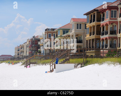 A photograph of beautiful, luxury beach houses sitting on the sugar white sands of the Florida panhandle Stock Photo