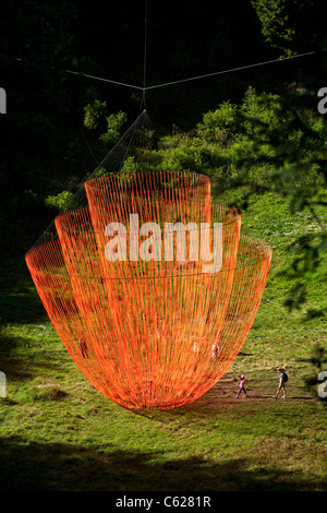 The Pier Fabre's Land Art work called 'the Wakening'. Giant suspended mobile sculpture with orange ribbons. Stock Photo