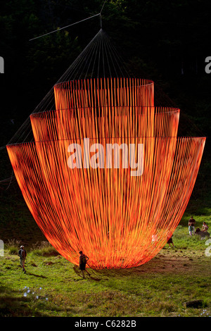 The Pier Fabre's Land Art work called 'the Wakening'. Giant suspended mobile sculpture with orange ribbons. Stock Photo