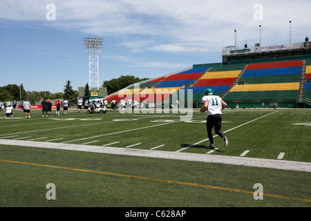 eddie johnson penalty kick taker running onto the pitch during saskatchewan roughriders pre season training mosaic stadium Stock Photo