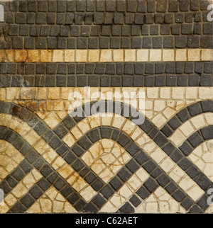 grunge and cracked old floor ornamental tile Stock Photo