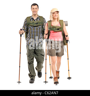 Full length portrait of a man and woman with backpacks and hiking poles Stock Photo