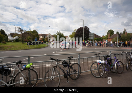 Crowds gather at the roadside to watch participants of the London Surrey Classic cycle event at the junction of the A24 and A25 Stock Photo