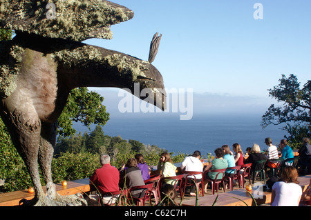 Tourists view the Pacific Ocean from the deck of the Nepenthe Restaurant in Big Sur, California Stock Photo