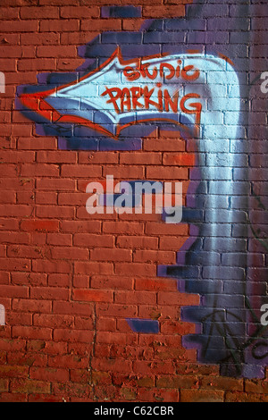 Historic downtown painting on a brick wall in La Crosse Wisconsin in USA US full frame shot of red bricks wall nobody vertical format hi-res Stock Photo