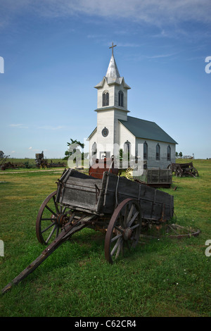 1880s historic wild west ghost town in South Dakota near Murdo in USA US old wooden wagon a church vertical nobody rural countryside historical hi-res Stock Photo