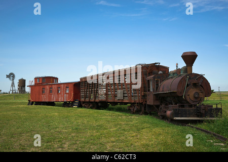 1880 historic wild west town in South Dakota near Murdo. Old train side historical train low angle nobody blue sky horizontal hi-res Stock Photo