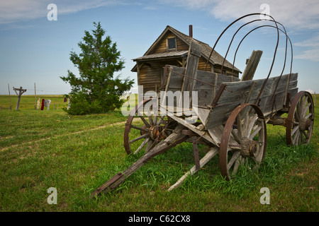 1880 historic wild west town in South Dakota near Murdo. Broken wooden wagon in front of buildings reenactment nobody horizontal USA US hi-res Stock Photo