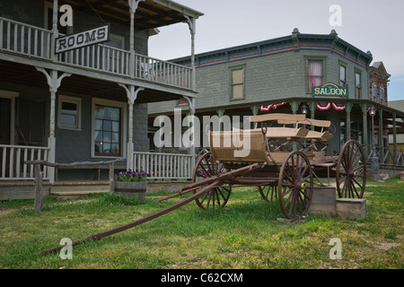 1880s historic wild west ghost town in South Dakota near Murdo in USA US old wooden wagon in front old buildings hotel and saloon nobody horizontal hi Stock Photo