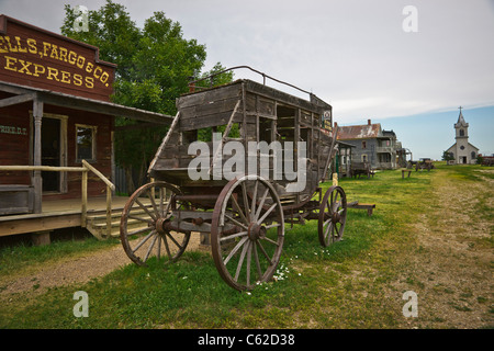 1880s historic wild west ghost town in South Dakota near Murdo in USA US old wooden coach in front old buildings nobody horizontal hi-res Stock Photo