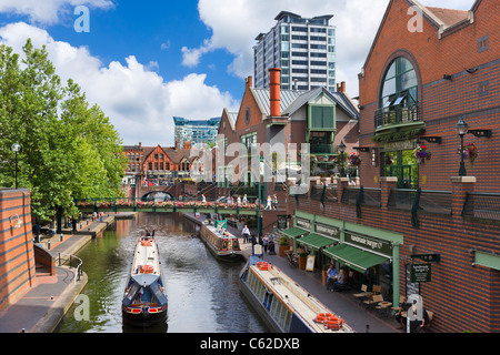 Narrowboats in front of restaurants on the canal at Brindley Place, Birmingham, UK Stock Photo