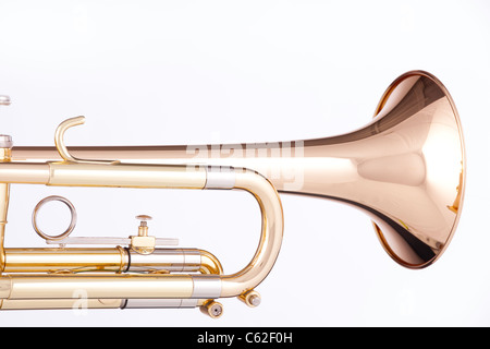 A gold and brass trumpet or cornet isolated against a white background. Stock Photo