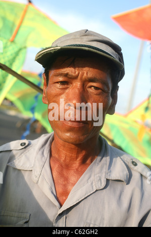 Portrait of Vietnamese man selling kites. Stock Photo