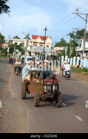 Men on a tractor, the most common work vehicle in the central highlands. Buon Ma Thuot, Dak Lak, Vietnam, South-East Asia, Asia Stock Photo