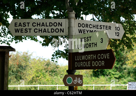 Old 1950s signpost directing traffic to various destinations in Dorset Stock Photo