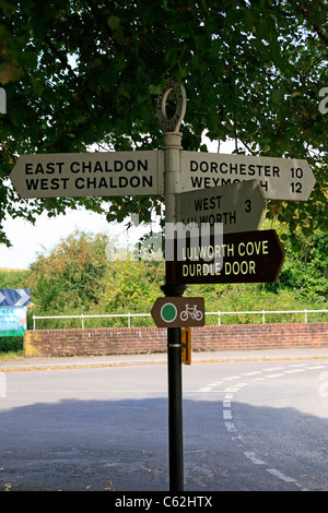 Old 1950s signpost directing traffic to various destinations in Dorset Stock Photo