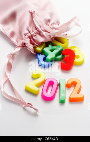 2012 new year and colorful plastic alphabet blocks in sachet Stock Photo