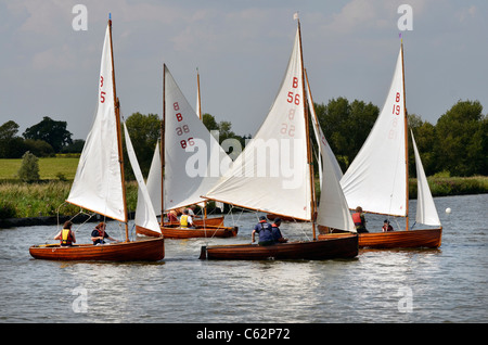 norfolk class dinghies racing on river waveney at beccles suffolk Stock Photo