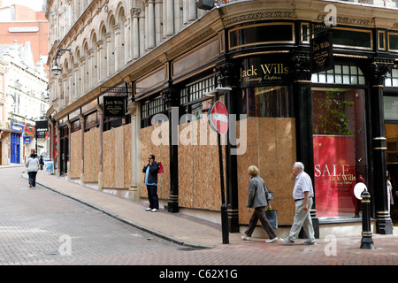 Boarded up shop windows off New Street Birmingham after the riots in 2011 Stock Photo