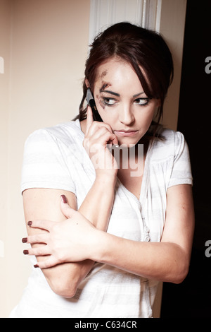 Abused woman calling for help Stock Photo