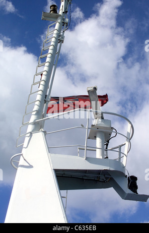 Close-up of  the Communication tower on the Isle of Wight Ferry with satellite receiver and British ensign flag Stock Photo