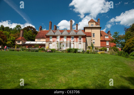 Standen House showing grassed area with a blue sky and clouds Stock Photo