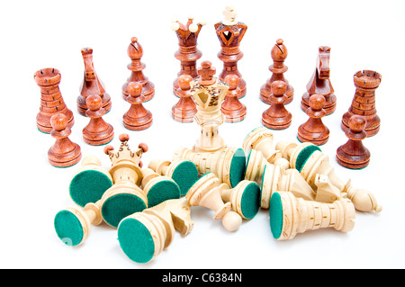 Defeat - last one standing, chess figures on white background Stock Photo
