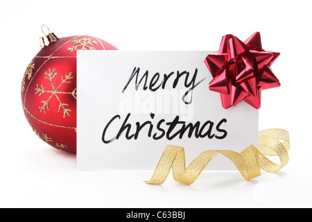 Christmas card with glossy ball and ribbon bow on white. Stock Photo