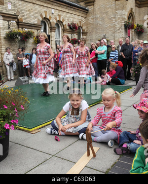 Young children watch Appalachian clog dancers 'Step This Way' perform at Saltburn Folk Festival, , North East England, UK Stock Photo