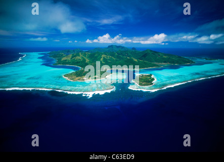 Aerial view of Huahine Island anchored in the blue South Pacific in the French Polynesia archipelago also called Society Islands Stock Photo