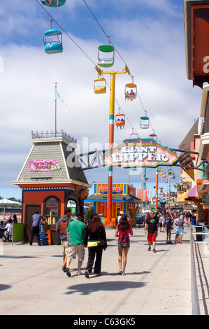 People Walking along the Santa Cruz Beach Boardwalk in Santa Cruz, California Stock Photo