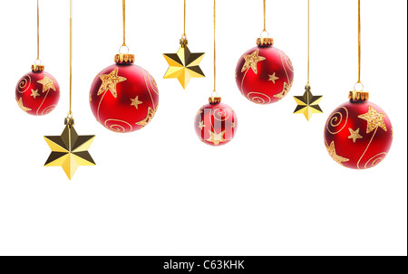 Shiny Christmas balls and gold stars isolated on white. Stock Photo