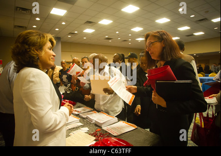 Job seekers attend a job fair in midtown in New York on Monday, August 15, 2011. ( © Frances M. Roberts) Stock Photo