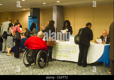 Job seekers attend a job fair in midtown in New York on Monday, August 15, 2011. ( © Frances M. Roberts) Stock Photo