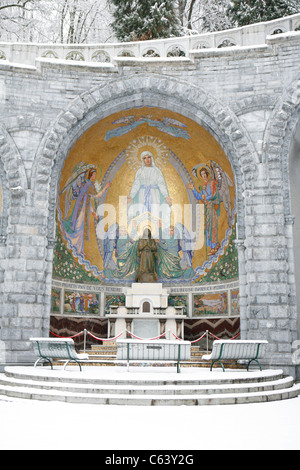 Lourdes in winter: Rosary Basilica and Bernadette Sourbirous, Sanctuary of Lourdes. Stock Photo