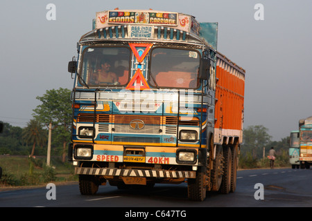 Convoy of trucks at sunset on the national highway to West Bengal India Stock Photo