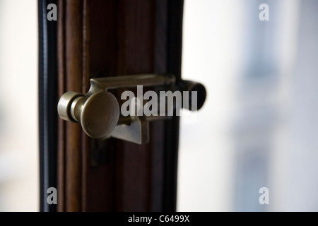 Old Brass window latch Stock Photo