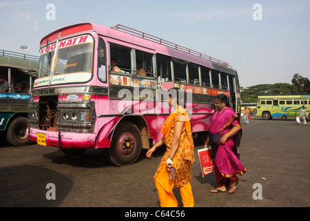 Women passengers board private Express bus departing from bus station in Thrissur Kerala India Stock Photo