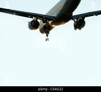 Airplane with jet engines before landing Stock Photo