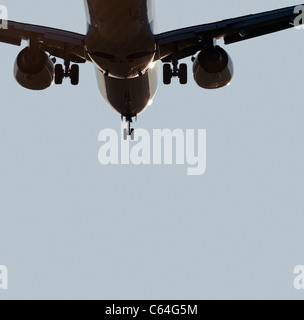 Airplane with two jet engines before landing Stock Photo