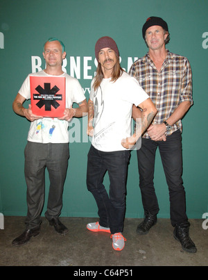 Anthony Kiedis, Flea, Chad Smith at a public appearance for The Red Hot Chili Peppers Book Signing, The Grove, Los Angeles, CA November 4, 2010. Photo By: Elizabeth Goodenough/Everett Collection Stock Photo