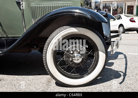 gleaming front fender & wire wheel with immaculate whitewall tire of classic Model A Ford Langley Whidbey Island Washington Stock Photo