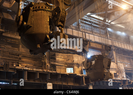 Smelting metal in a metallurgical plant. Liquid iron from the ladle. Russian metallurgy. Stock Photo