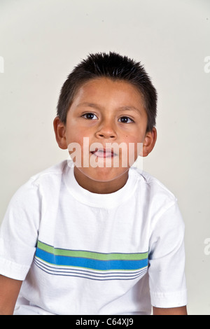 Thoughtful young 6-7 year old Hispanic boy child thoughtful dreaming sitting  MR © Myrleen Pearson Stock Photo