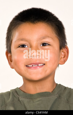 Cute young 6-7 year old Hispanic boy with two front teeth missing multi inter racial diversity racially diverse multicultural cultural interracial Stock Photo