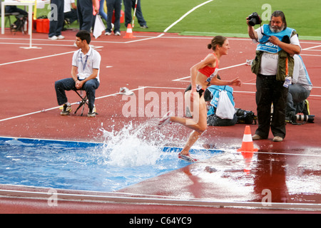 Athlete female runner and photographer in action at athletic race of Golden Gala of Rome Italy 2011 Stock Photo